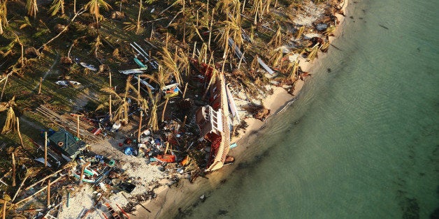 LEYTE, PHILIPPINES - NOVEMBER 14: An aerial view of a boat washed up ashore on the demolished coastal town of Eastern Samar
