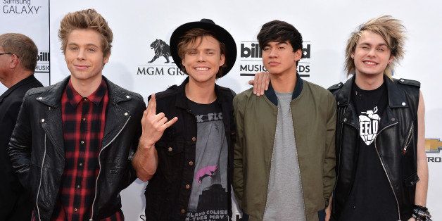 LAS VEGAS, NV - MAY 18: (L-R) Recording artists Luke Hemmings, Ashton Irwin, Calum Hood and Michael Clifford of 5 Seconds of Summer attend the 2014 Billboard Music Awards at the MGM Grand Garden Arena on May 18, 2014 in Las Vegas, Nevada. (Photo by Frazer Harrison/Getty Images)