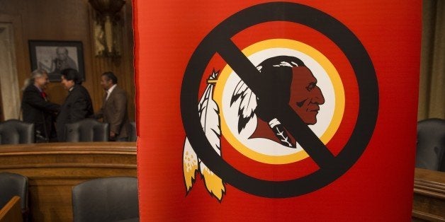 A poster for the 'Change the Mascot' campaign is seen prior to a press conference by the Oneida Indian Nation leaders on Capitol Hill in Washington, DC, September 16, 2014. 'Change the Mascot' is a national campaign to end the use of the racial slur Redskins as the mascot and name of the NFL team in Washington, DC. Launched by the Oneida Indian Nation, the campaign calls upon the NFL and Commissioner Roger Goodell to do the right thing and bring an end the use of the racial epithet. AFP PHOTO / Saul LOEB (Photo credit should read SAUL LOEB/AFP/Getty Images)