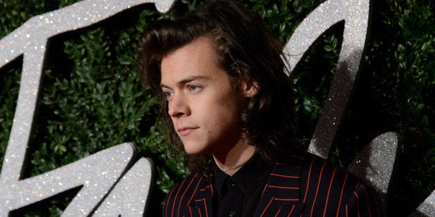 Harry Styles poses for photographers upon arrival at The British Fashion Awards 2014, in London, Monday, Dec. 1, 2014. (Photo