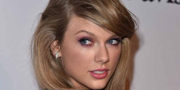 Taylor Swift arrives at the 2015 Clive Davis Pre-Grammy Gala at the Beverly Hilton Hotel on Saturday, Feb. 7, 2015, in Beverl