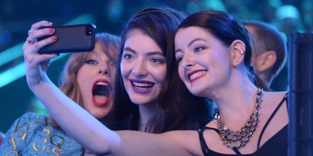 INGLEWOOD, CA - AUGUST 24: (L-R) Recording artists Taylor Swift, Lorde and guest take a selfie at the 2014 MTV Video Music Awards at The Forum on August 24, 2014 in Inglewood, California. (Photo by Jeff Kravitz/MTV1415/FilmMagic)