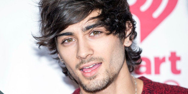 FILE - In this Sept. 20, 2014, file photo, One Direction's Zayn Malik arrives with bandmates to the iHeart Radio Music Festiv