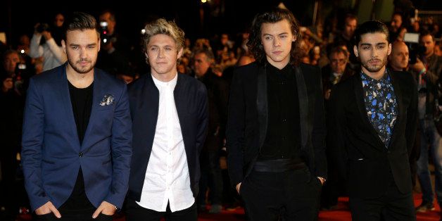 English Irish pop boy band One Direction arrives at the Cannes festival palace, to take part in the NRJ Music awards ceremony, Saturday, Dec. 13, 2014, in Cannes, southeastern France. (AP Photo/Lionel Cironneau)