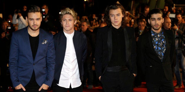English Irish pop boy band One Direction arrives at the Cannes festival palace, to take part in the NRJ Music awards ceremony