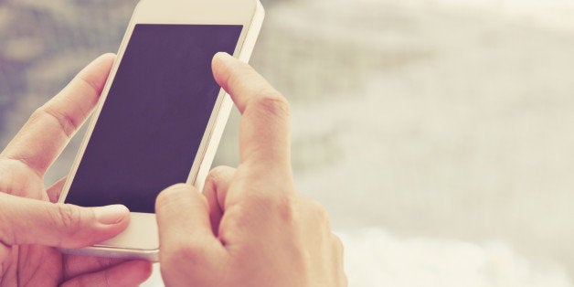 Close up image of Teenage girl text messaging on her phone