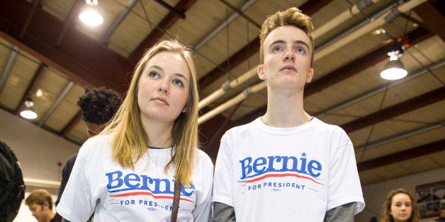 RINDGE, NH - FEBRUARY 6: Noah Pruzan-Jorgensen and Ida Schou, volunteers from Denmark, listen to Bernie Sanders speak at a Ge