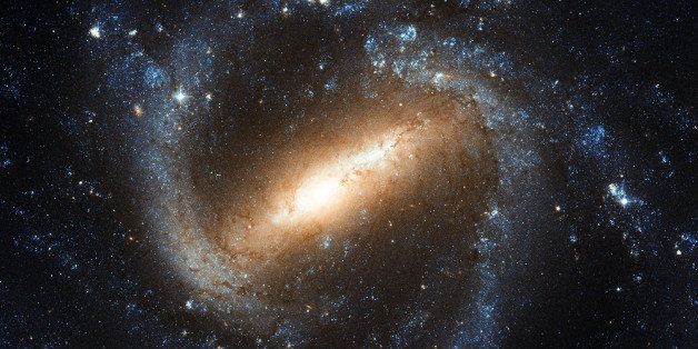 The NASA/ESA Hubble Space Telescope's picture of the barred spiral galaxy NGC 1073, which is found in the constellation of Cetus (The Sea Monster). Our own galaxy, the Milky Way, is a similar barred spiral, and the study of galaxies such as NGC 1073 helps astronomers learn more about our celestial home.Most spiral galaxies in the Universe have a bar structure in their centre, and Hubble's image of NGC 1073 offers a particularly clear view of one of these. Galaxies' star-filled bars are thought to emerge as gravitational density waves funnel gas toward the galactic centre, supplying the material to create new stars. The transport of gas can also feed the supermassive black holes that lurk in the centres of almost every galaxy.Some astronomers have suggested that the formation of a central bar-like structure might signal a spiral galaxy's passage from intense star-formation into adulthood, as the bars turn up more often in galaxies full of older, red stars than younger, blue stars. This storyline would also account for the observation that in the early Universe, only around a fifth of spiral galaxies contained bars, while more than two thirds do in the more modern cosmos.Credit: NASA/ESA/Hubble Space TelescopeAvailable as a 20x16 inch poster.Used at SciTechLab âKool Image Barred Spiral Galaxy NGC 1073 " blog post.