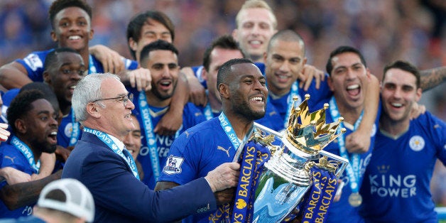 Britain Soccer Football - Leicester City v Everton - Barclays Premier League - King Power Stadium - 7/5/16Leicester City's Wes Morgan and manager Claudio Ranieri lift the trophy as they celebrate winning the Barclays Premier LeagueAction Images via Reuters / Carl RecineLivepicEDITORIAL USE ONLY. No use with unauthorized audio, video, data, fixture lists, club/league logos or "live" services. Online in-match use limited to 45 images, no video emulation. No use in betting, games or single club/league/player publications. Please contact your account representative for further details.