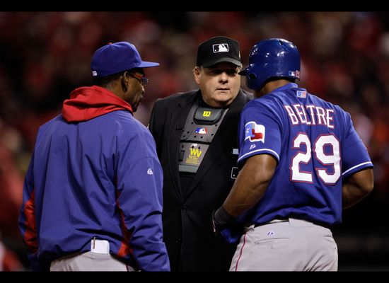 Adrian Beltre very sneakily tries to kick a slow roller foul