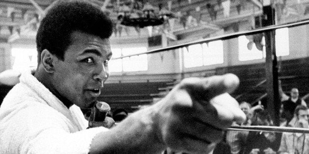 Heavyweight boxer Muhammad Ali makes a point during a news conference that he conducts from inside the ring in Atlanta, Ga.,