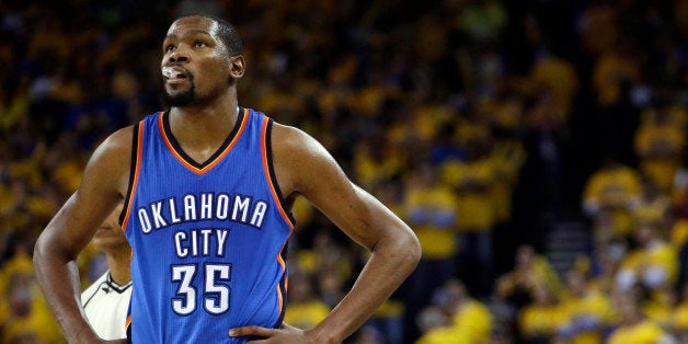 FILE - In this May 26, 2016, file photo, Oklahoma City Thunder's Kevin Durant watches during the closing minutes of the secon