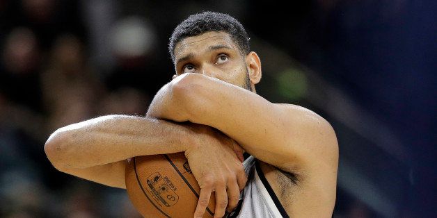San Antonio Spurs center Tim Duncan (21) holds the ball as he prepares for the first half in Game 1 of a first-round NBA basketball playoff series against the Memphis Grizzlies, Sunday, April 17, 2016, in San Antonio. (AP Photo/Eric Gay)