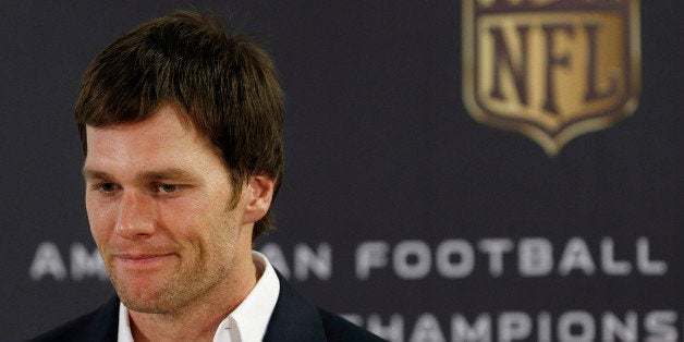 New England Patriots quarterback Tom Brady listens to a question during a press conference following the NFL football AFC Cha