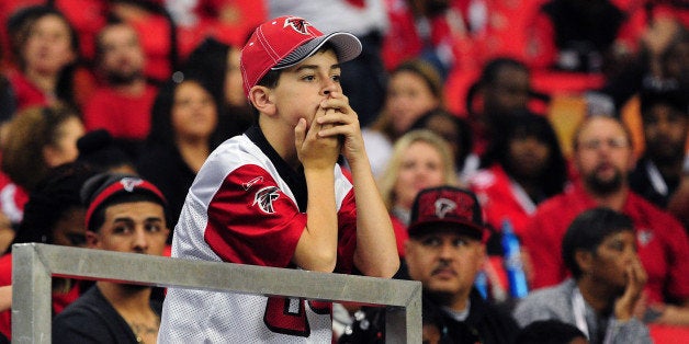 ATLANTA, GA - NOVEMBER 10: A young fan of the Atlanta Falcons watches the action against the Seattle Seahawks at the Georgia Dome on November 10, 2013 in Atlanta, Georgia. (Photo by Scott Cunningham/Getty Images)