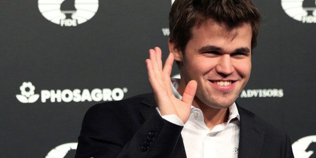 World Chess Champion Magnus Carlsen of Norway, smiles after defeating Sergey Karjakin (not shown) of Russia at the 2016 World Chess Championship match in New York, U.S., November 30, 2016. REUTERS/Mark Kauzlarich