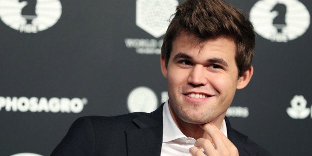 World Chess Champion Magnus Carlsen of Norway, smiles after defeating Sergey Karjakin (not shown) of Russia at the 2016 World Chess Championship match in New York, U.S., November 30, 2016. REUTERS/Mark Kauzlarich