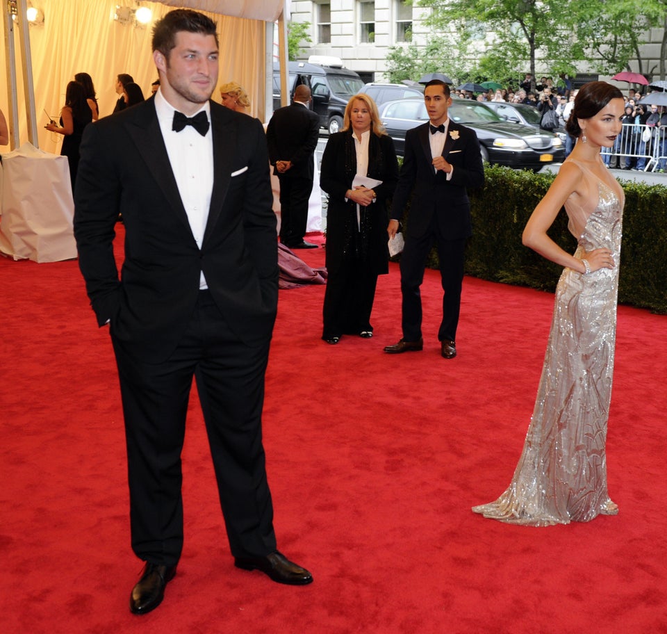 Camilla Belle and Tim Tebow attend the C