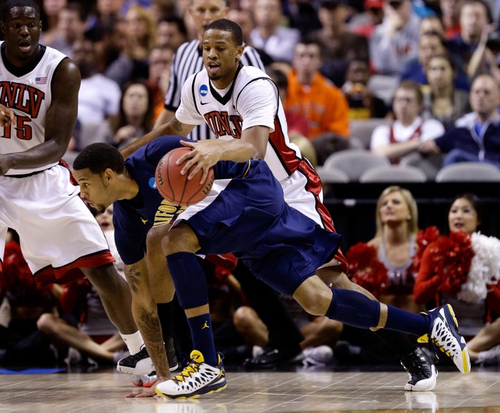 SAN JOSE, CA - MARCH 21: Allen Crabbe #23 of the California Golden Bears handles the ball against Bryce Dejean-Jones #13 of