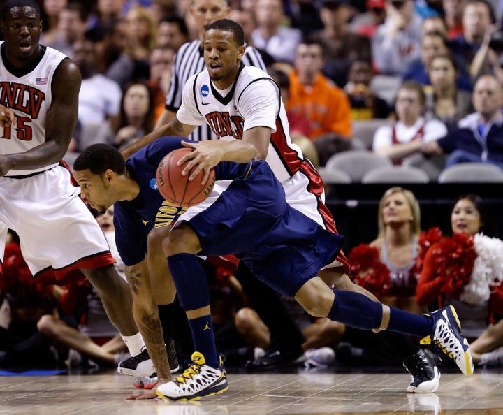 SAN JOSE, CA - MARCH 21: Allen Crabbe #23 of the California Golden Bears handles the ball against Bryce Dejean-Jones #13 of the UNLV Rebels in the first half during the second round of the 2013 NCAA Men's Basketball Tournament at HP Pavilion on March 21, 2013 in San Jose, California. (Photo by Ezra Shaw/Getty Images)