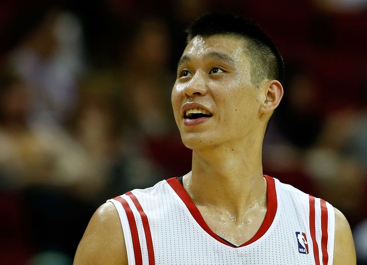 HOUSTON, TX - JANUARY 26: Jeremy Lin #7 of the Houston Rockets celebrates a play on the court during the game against the Brooklyn Nets at Toyota Center on January 26, 2013 in Houston, Texas. NOTE TO USER: User expressly acknowledges and agrees that, by downloading and or using this photograph, User is consenting to the terms and conditions of the Getty Images License Agreement. (Photo by Scott Halleran/Getty Images)