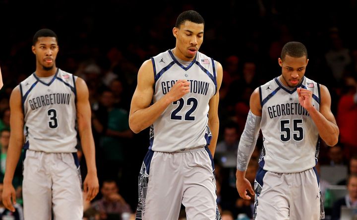 NEW YORK, NY - MARCH 15: (L-R) Mikael Hopkins #3, Otto Porter Jr. #22 and Jabril Trawick #55 of the Georgetown Hoyas walk back to the bench in the second half against the Syracuse Orange during the semifinals of the Big East Men's Basketball Tournament at Madison Square Garden on March 15, 2013 in New York City. (Photo by Al Bello/Getty Images)