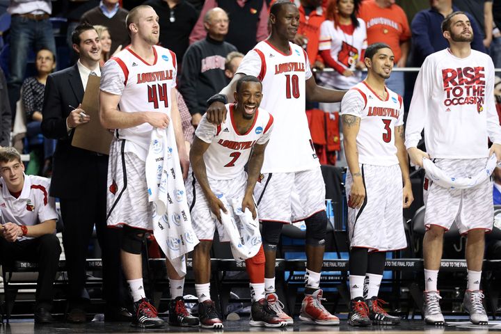 LEXINGTON, KY - MARCH 21: Stephan Van Treese #44, Russ Smith #2 , Gorgui Dieng #10, Peyton Siva #3 and Luke Hancock #11 of the Louisville Cardinals look on from the bench towards the end of the game against the North Carolina A&T Aggies during the second round of the 2013 NCAA Men's Basketball Tournament at the Rupp Arena on March 21, 2013 in Lexington, Kentucky. (Photo by Andy Lyons/Getty Images)