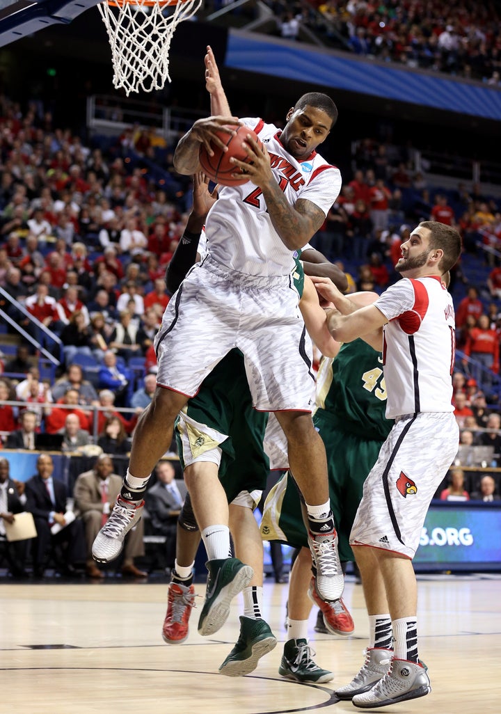 LEXINGTON, KY - MARCH 23: Chane Behanan #21 of the Louisville Cardinals pulls down a rebound against the Colorado State Rams