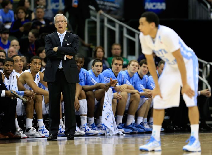 KANSAS CITY, MO - MARCH 22: Head coach Roy Williams of the North Carolina Tar Heels watches play as Marcus Paige #5 stands on the court in the first half against the Villanova Wildcats during the second round of the 2013 NCAA Men's Basketball Tournament at the Sprint Center on March 22, 2013 in Kansas City, Missouri. (Photo by Jamie Squire/Getty Images)