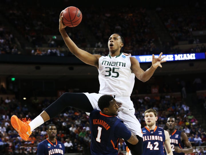AUSTIN, TX - MARCH 24: Kenny Kadji #35 of the Miami Hurricanes goes up against D.J. Richardson #1 of the Illinois Fighting I