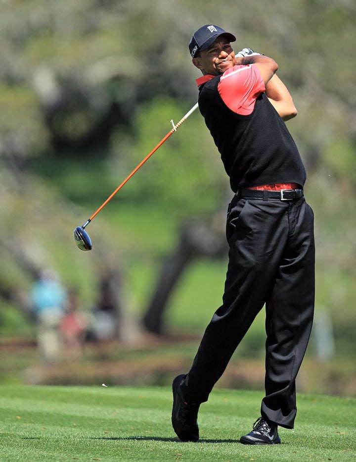 ORLANDO, FL - MARCH 25: Tiger Woods of the United States plays his tee shot at the par 5, 16th hole during the final round o