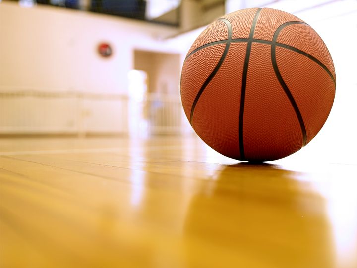 Basketball on gymnasium floor