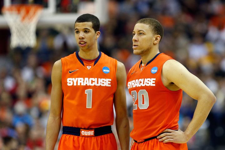 WASHINGTON, DC - MARCH 30: Michael Carter-Williams #1 and Brandon Triche #20 of the Syracuse Orange look on against the Marquette Golden Eagles during the East Regional Round Final of the 2013 NCAA Men's Basketball Tournament at Verizon Center on March 30, 2013 in Washington, DC. (Photo by Rob Carr/Getty Images)