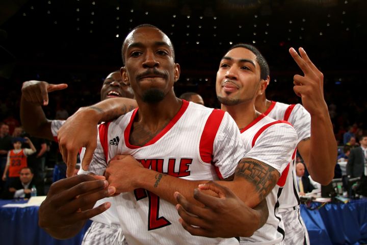 NEW YORK, NY - MARCH 16: (L-R) Russ Smith #2 and Peyton Siva #3 of the Louisville Cardinals celebrate after they won 78-61 against the Syracuse Orange during the final of the Big East Men's Basketball Tournament at Madison Square Garden on March 16, 2013 in New York City. (Photo by Elsa/Getty Images)