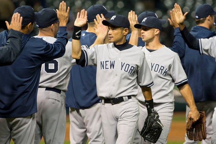 CLEVELAND, OH - APRIL 9: Ichiro Suzuki #31 and Brett Gardner #11 of the New York Yankees celebrate after defeating the Cleveland Indians at Progressive Field on April 9, 2013 in Cleveland, Ohio. The Yankees defeated the Indians 14-1. (Photo by Jason Miller/Getty Images)