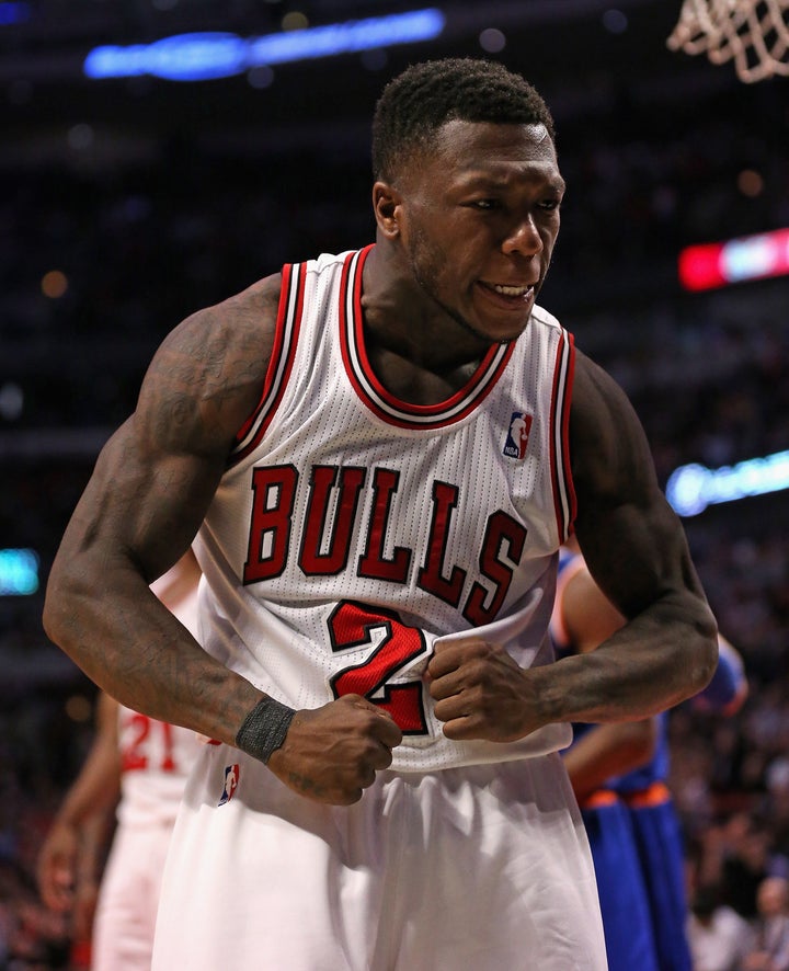 CHICAGO, IL - APRIL 11: Nate Robinson #2 of the Chicago Bulls celebrates hitting a shot against the New York Knicks at the U