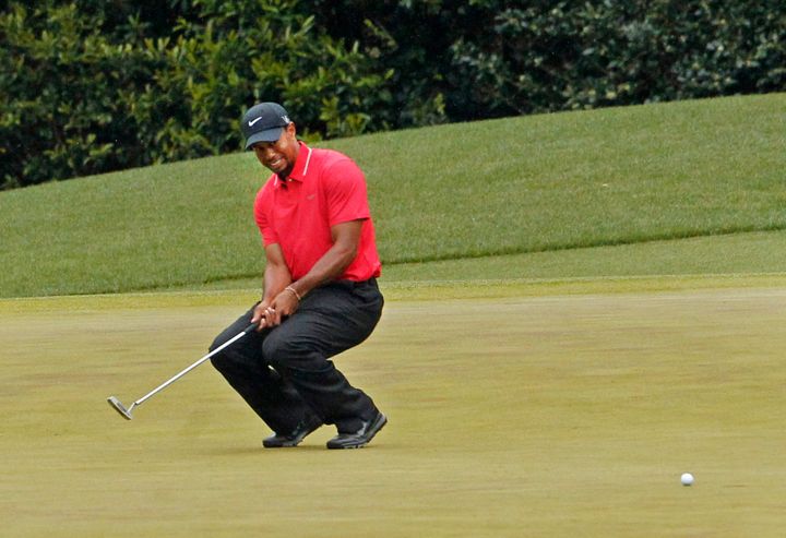 Tiger Woods reacts after his birdie putt on hole No. 4 comes up short during the final round in The Masters at Augusta National Golf Club in Augusta, Georgia, Sunday, April 14, 2013. (Gerry Melendez/The StateMCT via Getty Images)