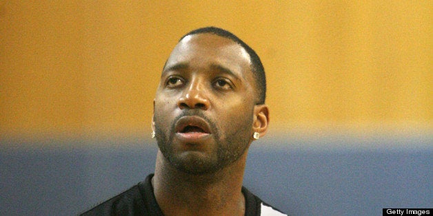 QINGDAO, CHINA - OCTOBER 25: (CHINA OUT) American professional basketball player Tracy McGrady of Qingdao Eagles attends a t