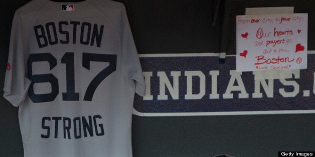 CLEVELAND, OH - APRIL 16: Shane Victorino of the Boston Red Sox sits in the dugout with a jersey paying tribute to those affected by event in Boston prior to the start of the game between the Cleveland Indians and the Boston Red Sox at Progressive Field on April 16, 2013 in Cleveland, Ohio. (Photo by Jason Miller/Getty Images)