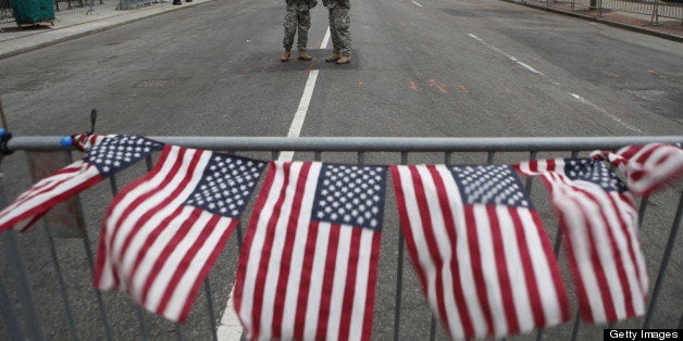 BOSTON, MA - APRIL 16: American flags on a roadblock fly in remembrance of victims of the bombing of the Boston Marathon at a