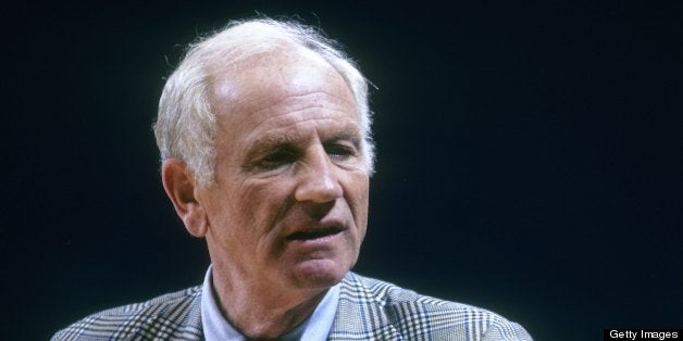 CIRCA 1970's: Red Holzman coach of the New York Knicks standing and coaching during a mid circa 1970's NBA basketball game. Holzman coached the Knickerbockers from 1968-77. (Photo by Focus on Sport/Getty Images)