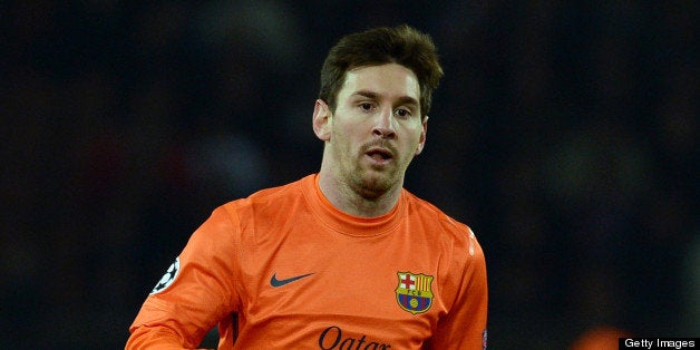 Barcelona's Argentinian forward Lionel Messi runs with the ball during the Champions League quarter-final football match between Paris Saint-Germain and Barcelona at the Parc des Princes stadium in Paris on April 2, 2013. AFP PHOTO / FRANCK FIFE (Photo credit should read FRANCK FIFE/AFP/Getty Images)