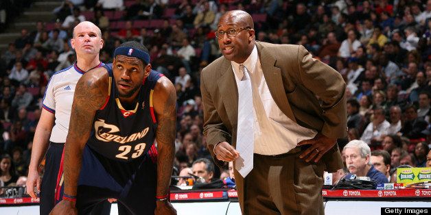 EAST RUTHERFORD, NJ - MARCH 12: LeBron James #23 of the Cleveland Cavaliers talks with Head Coach, Mike Brown, during the game against the New Jersey Nets on March 12, 2008 at the Izod Center in East Rutherford, New Jersey. NOTE TO USER: User expressly acknowledges and agrees that, by downloading and or using this Photograph, user is consenting to the terms and conditions of the Getty Images License Agreement. Mandatory Copyright Notice: Copyright 2008 NBAE (Photo by Jesse D. Garrabrant/NBAE via Getty Images) 