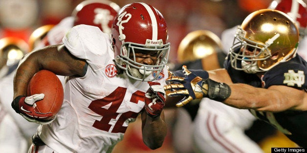 MIAMI GARDENS, FL - JANUARY 7: Eddie Lacy #42 of the Alabama Crimson Tide runs with the ball against the Notre Dame Fighting