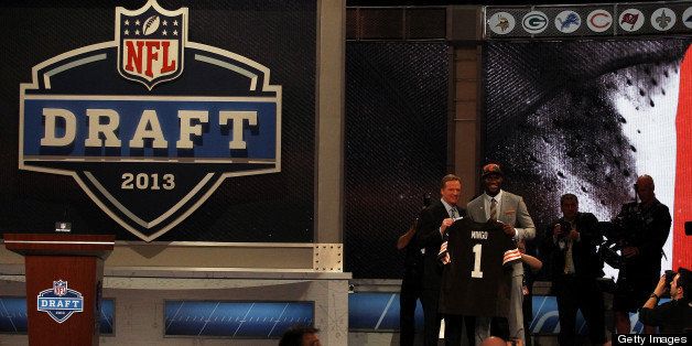 NEW YORK, NY - APRIL 25: Barkevious Mingo of the LSU Tigers stands on stage with NFL Commissioner Roger Goodell as they hold up a jersey on stage after Mingo was picked #6 overall by the Cleveland Browns in the first round of the 2013 NFL Draft at Radio City Music Hall on April 25, 2013 in New York City. (Photo by Chris Chambers/Getty Images) 