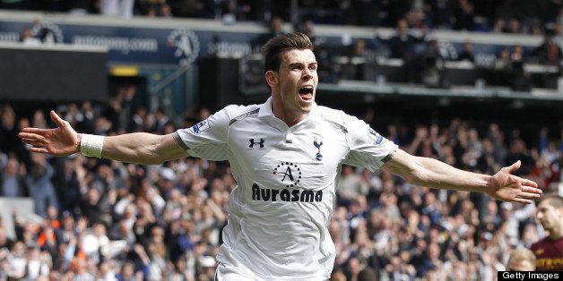 Tottenham Hotspur's Welsh midfielder Gareth Bale celebrates scoring their third goal during the English Premier League football match between Tottenham Hotspur and Manchester City at White Hart Lane in north London on April 21, 2013. AFP PHOTO / IAN KINGTON RESTRICTED TO EDITORIAL USE. No use with unauthorized audio, video, data, fixture lists, club/league logos or ?live? services. Online in-match use limited to 45 images, no video emulation. No use in betting, games or single club/league/player publications (Photo credit should read IAN KINGTON/AFP/Getty Images)