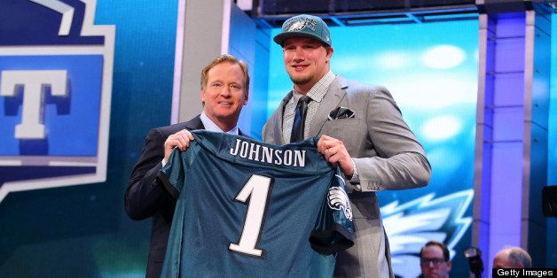 NEW YORK, NY - APRIL 25: Lane Johnson of the Oklahoma Sooners stands with NFL Commissioner Roger Goodell (L) as they hold up a jersey on stage after Johnson was picked #4 overall by the Philadelphia Eagles in the first round of the 2013 NFL Draft at Radio City Music Hall on April 25, 2013 in New York City. (Photo by Al Bello/Getty Images)
