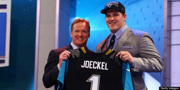 NEW YORK, NY - APRIL 25: Luke Joeckel (R) of the Texas A&M Aggies stands with NFL Commissioner Roger Goodell as they hold up a jersey on stage after Joeckel was picked #2 overall by the Jacksonville Jaguars in the first round of the 2013 NFL Draft at Radio City Music Hall on April 25, 2013 in New York City. (Photo by Al Bello/Getty Images)