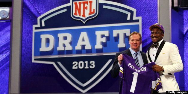 NEW YORK, NY - APRIL 25: Cordarelle Patterson (L) of the Tennessee Volunteers stands with NFL Commissioner Roger Goodell as they hold up a jersey after Patterson was selected #29 overall by the Minnesota Vikings in the first round of the 2013 NFL Draft at Radio City Music Hall on April 25, 2013 in New York City. (Photo by Al Bello/Getty Images)