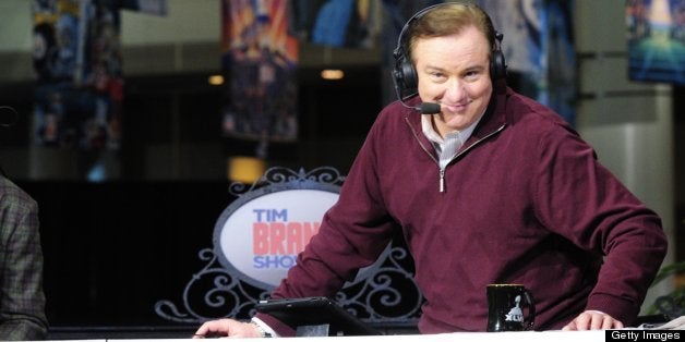 NEW ORLEANS - JANUARY 31: Former New Orleans Saints QB Archie Manning laughs as Tim Brando does a photo pose during his broad